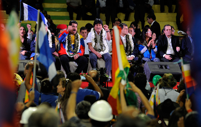 Bolivia's President Evo Morales (C) and his counterparts Nicolas Maduro (C left) of Venezuela and Rafael Correa (C, right) of Ecuador, are pictured during a welcoming gathering in honour of Morales, in Cochabamba, on July 4, 2013 (AFP Photo / Jorge Bernal)