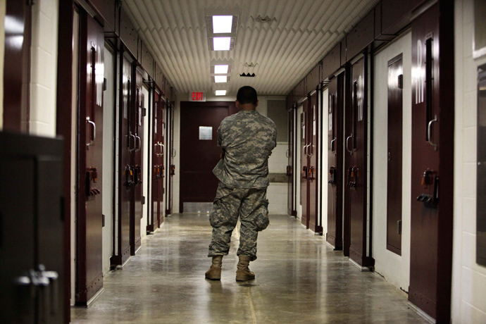 In this photo, reviewed by the U.S. military, a guard stands in a cell block at Camp 5 detention facility at Guantanamo Bay U.S. Naval Base, Cuba (Reuters / Brennan Linsley)