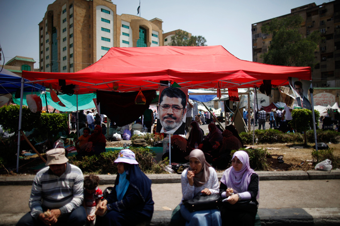 A portrait of deposed Egyptian President Mohamed Mursi is seen at the Raba El-Adwyia mosque square in Cairo July 6, 2013 (Reuters / Suhaib Salem)