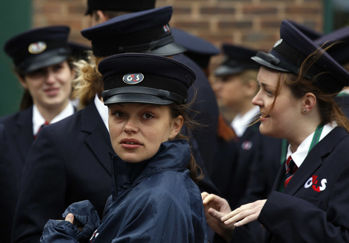 Security staff hired by multinational firm G4S are briefed a day before the start of the Wimbledon Tennis Championships in London June 23, 2013. (Reuters/Chris Helgren)