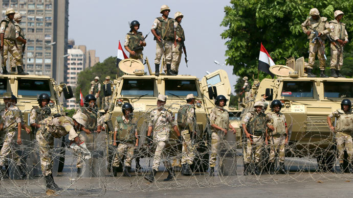 Egyptian army soldiers block Salah Salem highway to prevent supporters of the Muslim Brotherhood and ousted Egyptian president Mohamed Morsi from crossing during their demonstration in Cairo, on July 19, 2013.(AFP Photo / Marwan Naamani)