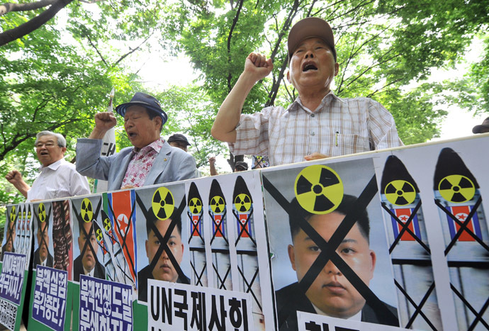 South Korean conservative activists hold placards showing portraits of North Korean leader Kim Jong-Un during an anti-Pyongyang rally to mark the 63th anniversary of the Korean War and denouncing North Korea's nuclear programs, in Seoul on June 24, 2013. (AFP Photo)