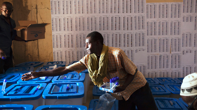 An electoral official arranges voting boxes in Timbuktu July 26, 2013 (Reuters / Joe Penney) 