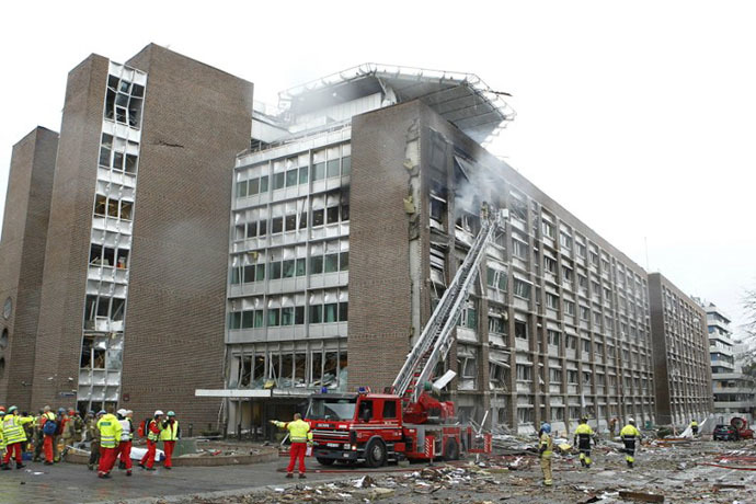Firefigthers work at the site of an explosion near government buildings in Norway's capital Oslo on July 22, 2011. (AFP Photo / Roald Berit)
