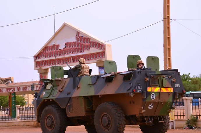 An armoured vehicle of the French Army rides by the former Sharia place now again Independence Square during a patrol on July 29, 2013 in Gao, a day after the vote for the presidential election (AFP Photo / Boureima Hama)
