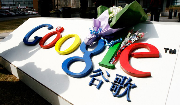 A bouquet of flowers lies on the Google logo outside the company's China head office in Beijing on March 23, 2010 after the US web giant said it would no longer filter results and was redirecting mainland Chinese users to an uncensored site in Hong Kong â effectively closing down the mainland site. (AFP Photo / Li Xin)