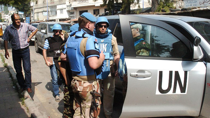 A team of United Nations observers touring the Syrian town of al-Haffe in the Mediterranean province of Latakia (file photo) (AFP Photo / SANA)