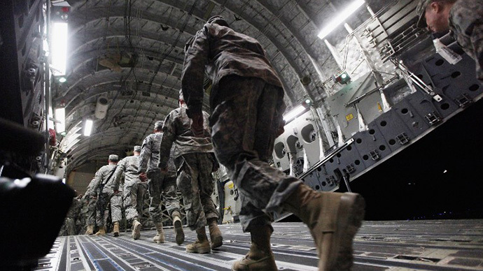 Soldiers from the 3rd Brigade, 1st Cavalry Division board a C-17 transport plane to depart from Iraq at Camp Adder, now known as Imam Ali Base, on December 17, 2011 near Nasiriyah, Iraq. (AFP Photo / Mario Tama)