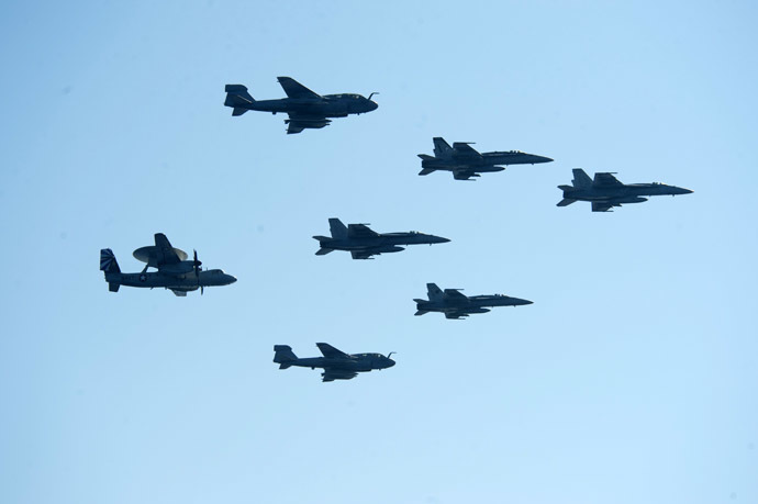 A picture released by the US Navy shows aircrafts assigned to Carrier Air Wing 7 fly in formation above the aircraft carrier USS Dwight D. Eisenhower (CVN 69) on June 15, 2013 in the Mediterranean Sea. (AFP Photo/US Navy)