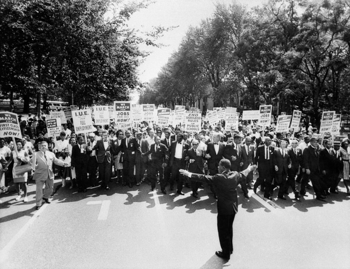 he clergyman and civil rights leader Martin Luther KIng (C) and other black and white civil right leaders march 28 August 1963 on the Mall in Washington DC during the "March on Washington". (AFP Photo)