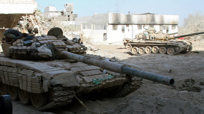 Syrian army tanks are seen deployed in the Jobar neighbourhood of Damascus on August 24, 2013.(AFP Photo / STR)