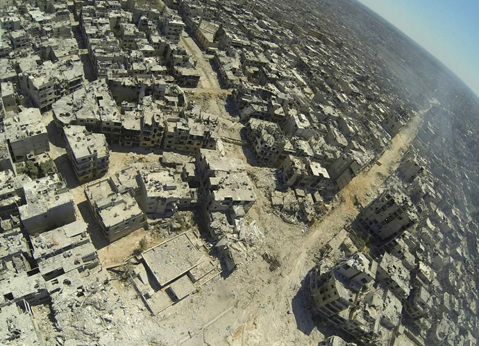 A handout image released by the Syrian opposition's Shaam News Network on July 29, 2013, shows an aerial view of destruction in the al-Khalidiyah neighbourhood of the central Syrian city of Homs. (AFP Photo/Shaam News Network)