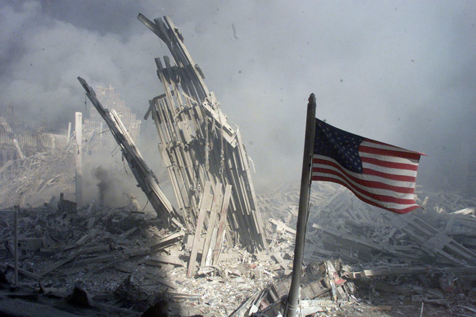 An American flag flies near the base of the destroyed World Trade Center in New York, in this file photo from September 11, 2001, taken after the collapse of the towers. (Reuters/Peter Morgan)