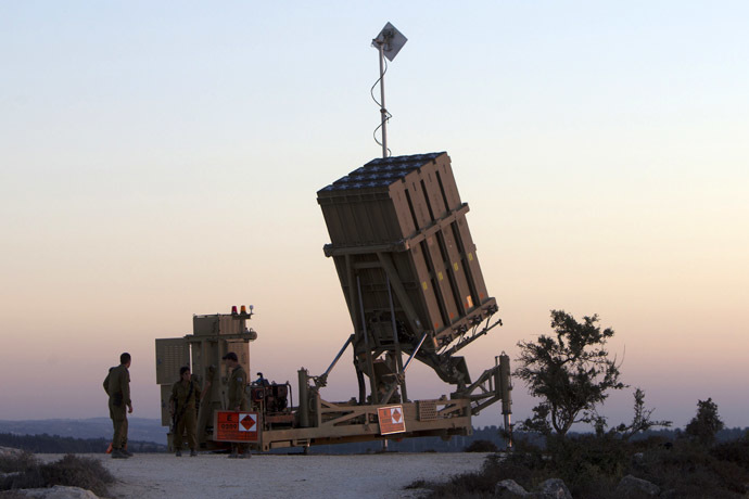 Israeli soldiers stand near an "Iron Dome" battery, a short-range missile defence system, designed to intercept and destroy incoming short-range rockets and artillery shells, near Jerusalem (AFP Photo)