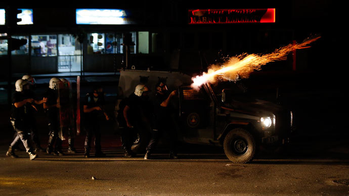 Riot police fire tear gas at protesters during clashes in central Hatay, September 11, 2013. (Reuters / Umit Bektas)
