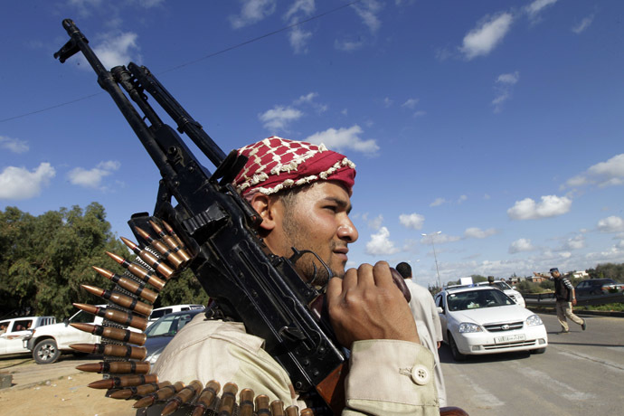 Fighters from Zawiya man a checkpoint at the entrance of the city after clashes between the Warchafana and Zawiya tribes at checkpoint 27 about 27 km west of the capital Tripoli on November 12, 2011. (AFP Photo)