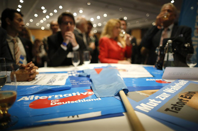 Supporters of the Alternative for Germany party (AfD) celebrates after exit polls are broadcast on television in Berlin on September 22, 2013, after the German general elections. (AFP Photo / Philipp Guelland)