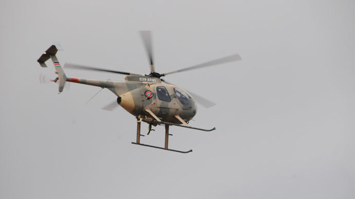 Military helicopter over Westgate. Photo by Andre Vltchek