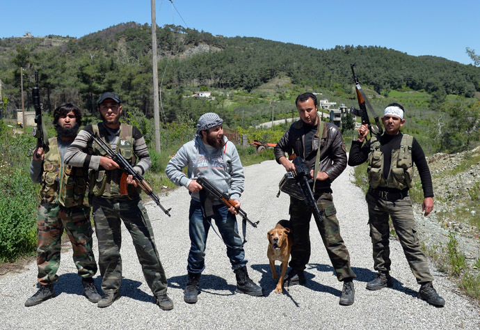 Rebel fighters from the Al-Ezz bin Abdul Salam Brigade pose for picture as they attend a training session at an undisclosed location near the al-Turkman mountains, in Syria's northern Latakia province, on April 24, 2013. (AFP Photo)