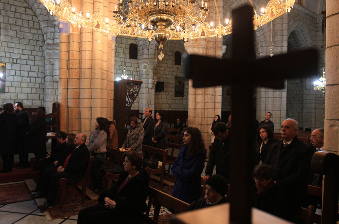 Syrian Christians attend Christmas Day mass at the Saint George Monastery in Mishtaya, some 50 kms from Homs (AFP Photo / Louai Beshara)