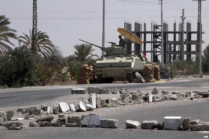 An Egyptian soldier stands guard at a checkpoint in Rafah city on the Egyptian border (Reuters)