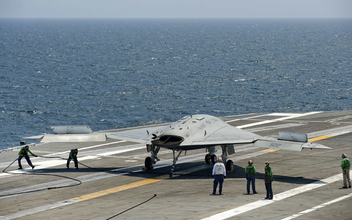 An X-47B pilot-less drone combat aircraft is prepared for launch from the deck of the USS George H. W. Bush aircraft carrier in the Atlantic Ocean off the coast of Norfolk, Virginia, July 10, 2013. (Reuters/Rich-Joseph Facun) 