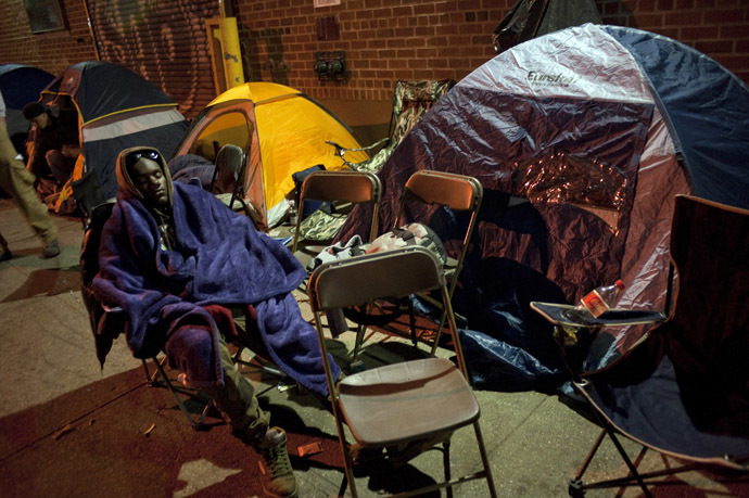 A job seeker sleeps in a lawn chair as he waits in front of the training offices of Local Union 46, a union representing metallic lathers and reinforcing ironworkers, in the Queens borough of New York (Reuters/Keith Bedford)