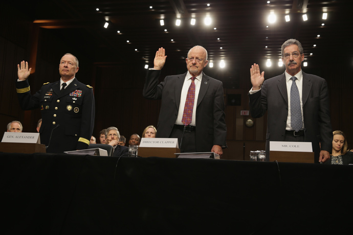 (L-R) National Security Agency Director General Keith Alexander, Director of National Intelligence James Clapper, Deputy Attorney General James Cole are sworn in during a hearing before the Senate (Select) Intelligence Committee September 26,2 103 on Capitol Hill in Washington, DC (Alex Wong / Getty Images / AFP) 