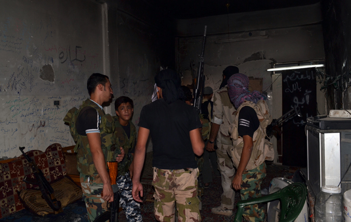 Syrian rebels meeting in a room in the northeastern city of Deir Ezzor (AFP Photo / HO / Huthaifa Al-Maaruf)