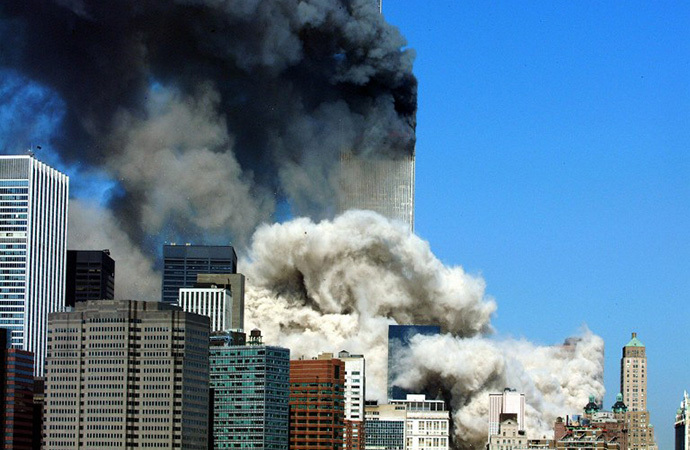 (FILES) This 11 September, 2001 file photo shows smoke billowing up after the first of the two towers of the World Trade Center collapses in New York City. (AFP Photo / Henny Ray Abrams)