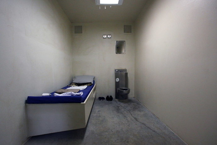 The interior of an unoccupied cell showing standard issue clothing given to prisoners is seen at Camp VI, a prison used to house detainees at the U.S. Naval Base at Guantanamo Bay (Reuters/Bob Strong)