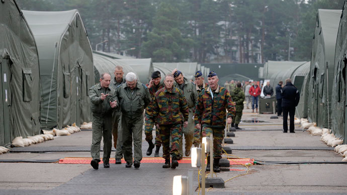 Military personnel walk in a military base during the "Steadfast Jazz" military exercise in Adazi November 6, 2013. (Reuters / Ints Kalnins)