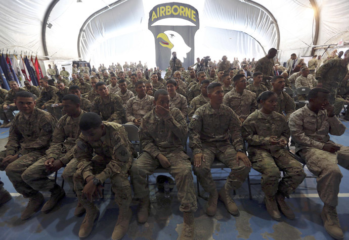 U.S. soldiers attend a naturalization ceremony while celebrating Fourth of July at Bagram airbase, north of Kabul, July 4, 2013. (Reuters/Omar Sobhani)