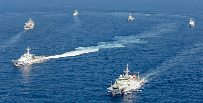 Vessels from the China Maritime Surveillance and the Japan Coast Guard are seen near disputed islands, called Senkaku in Japan and Diaoyu in China, in the East China Sea, in this photo taken by Kyodo (Reuters / Kyodo)