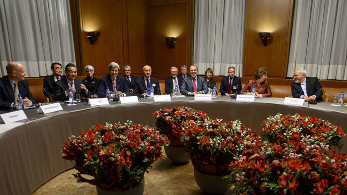 (L to R) British Foreign Secretary William Hague, Chinese Foreign Minister Wang Yi, US Secretary of State John Kerry, French Foreign Minister Laurent Fabius, Russian Foreign Minister Sergei Lavrov, EU foreign policy chief Catherine Ashton and Iranian Foreign Minister Mohammad Javad Zarif attend a plenary session on early November 24, 2013 in Geneva.(AFP Photo / Fabrice Coffrini)