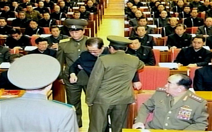 The video shows Jang Song-Thaek reportedly being dragged from his chair by two police officials during a meeting in Pyongyang (YONHAP/AFP)