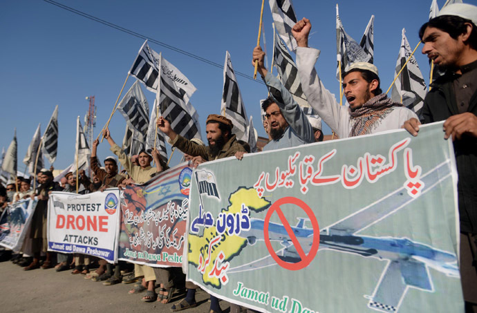Supporters of Pakistan's banned Islamic group Jamaat-ud-Dawa (JuD) carry banners and shout anti-US slogans during a protest against US drone strikes in Pakistan's tribal region, in Peshawar on November 29, 2013. (AFP Photo/A Majeed)