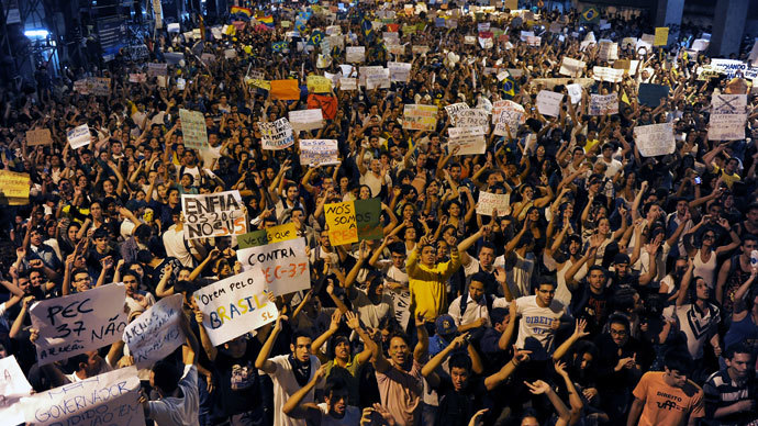 Thousands of demonstrators walk downtown Niteroi, near Rio de Janeiro, on June 19, 2013, during a protest against the $15 billion being spent on this month's Confederations Cup and the 2014 World Cup.( AFP Photo / Tasso Marcleo)