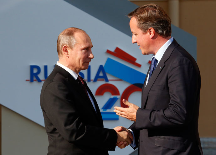Russia's President Vladimir Putin (L) welcomes Britain's Prime Minister David Cameron before the first working session of the G20 Summit in Constantine Palace in Strelna near St. Petersburg, September 5, 2013.(Reuters / Grigory Dukor)