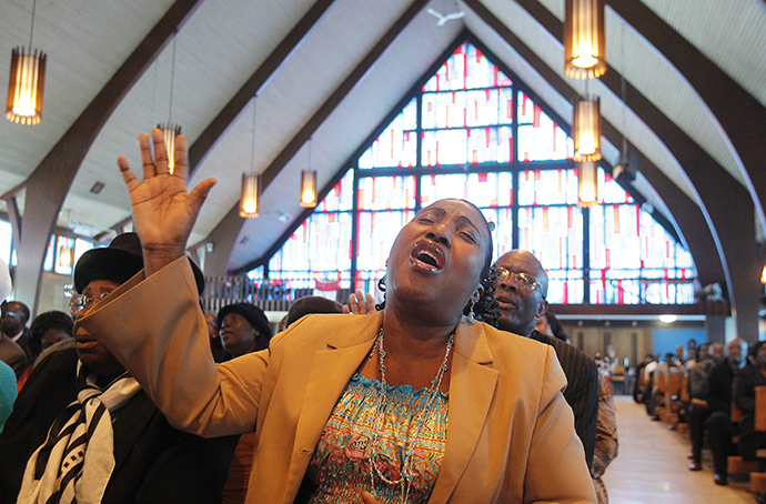 Congregation members participate during a service at the Haitian Evangelical Church of the Christian & Missionary Alliance (Reuters / Christinne Muschi)