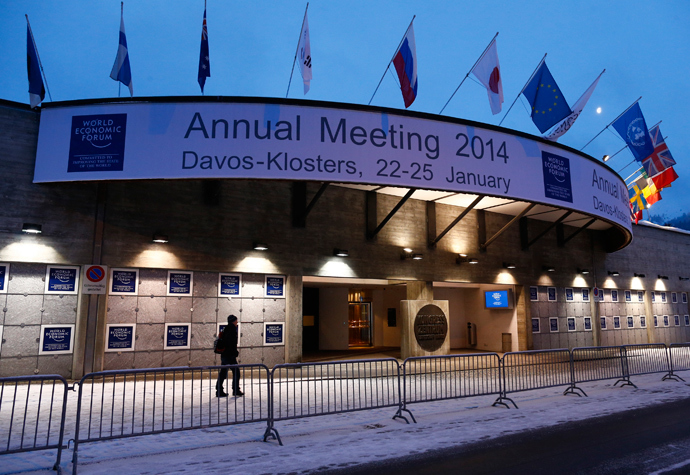 A person walks past the entrance of the congress centre for the annual meeting of the World Economic Forum (WEF) 2014 in the early morning in Davos January 21, 2014. (Reuters / Ruben Sprich)
