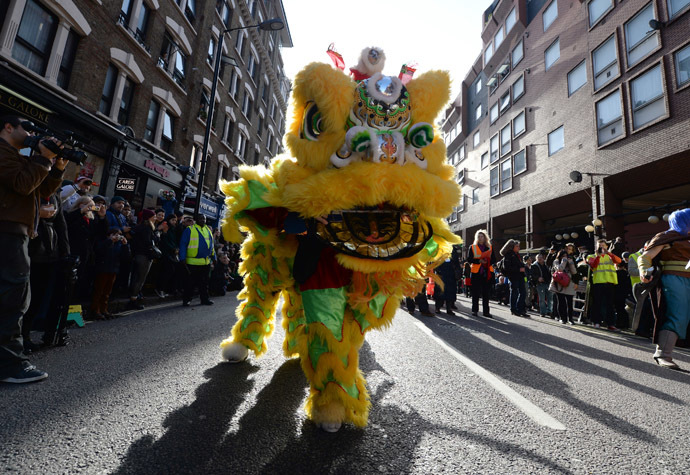 Revellers dressed in traditional costume perform during a parade celebrating Chinese New Year, the Year of the Horse, in central London February 2, 2014. (Reuters/Neil Hall)