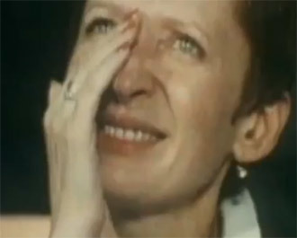 A spectator wiping her tears at the 1980 Summer Olympic Games in Moscow (screenshot from youtube.com)