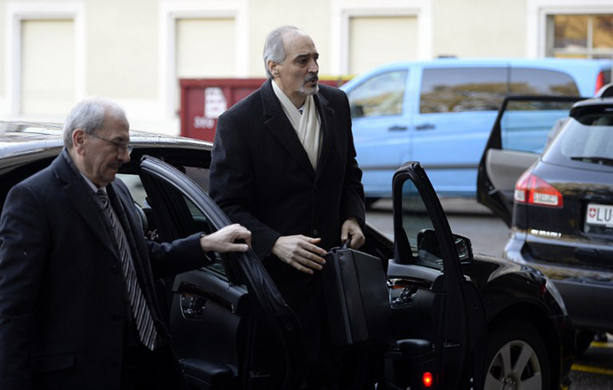 Syria's permanent representative at the United Nations Bashar al-Jaafari (C) arrives to attend a meeting during the second round of peace talks, "Geneva II", dedicated to the ongoing conflict in Syria, at the United Nations on February 11, 2014 in Geneva. (AFP Photo / Philippe Desmazes)