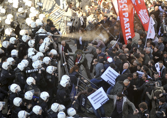 Riot police use tear gas and water canon to disperse protesters as they try to march to the parliament during a protest against Turkey's ruling Ak Party (AKP) and Prime Minister Tayyip Erdogan in Ankara February 13, 2014. (Reuters)