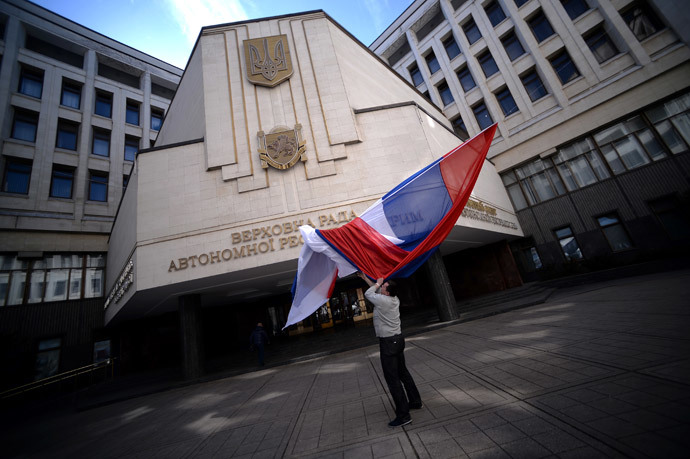 A Russian flag blows inside the entrance of Crimea's regional parliament building in Simferopol on March 13, 2014.(AFP Photo / Filippo Monteforte )
