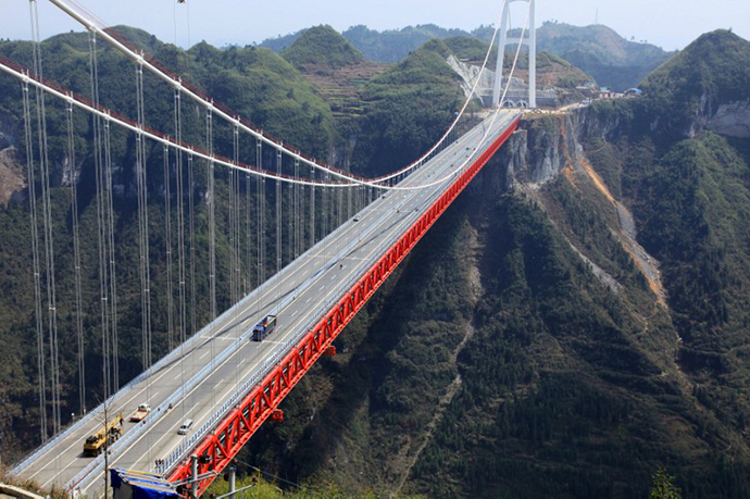The Aizhai bridge, the worldÃ­s highest tunnel to tunnel bridge, at 336 meter-high (1,102 feet) and spanning 1,176 meters (3,858 feet), officially opens to traffic in Jishou, central China's Hunan province on March 31, 2012. (AFP Photo)