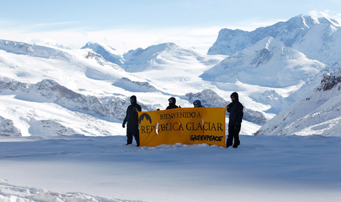 Greenpeace activists hold up a banner that reads, "Welcome to Republica Glaciar (Glacier Republic)" during its symbolic founding, some 5,000 meters (16,404 ft.) above sea level, at Los Andes Mountain range, near Santiago city, March 2, 2014.(Reuters / Ivan Alvarado )