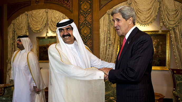 US Secretary of State John Kerry (R) shakes hands with Qatari Emir Sheikh Hamad bin Khalifa al-Thani during a meeting at Wajbah Palace in Doha on June 23, 2013. (AFP Photo / Jacquelyn Martin)