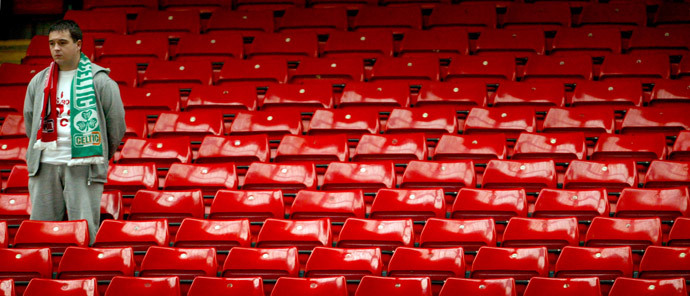 A soccer fan stands in the Kop during a ceremony to mark the 15th anniversary of the Hillsborough disaster at Liverpool's Anfield stadium, April 15, 2004. (Reuters / Darren Staples)
